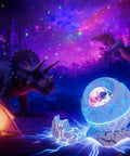 Dinosaur Egg Galaxy Star Projector Nebula Night Light with remote and timer in forest scene, surrounded by dinosaur figures.