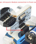Mini Cutebot Robot Car Kit For BBC Micro:bit v2 And V1 - DIY Programmable STEM Car With Dual Motors, Graphical MakeCode Coding, Educational Build For Kids, Cute Compact Design, Battery Not Included. Ultrasonic sensor front-row connection detail.