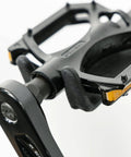 Wall Mounted Bike Pedal Hook Rack For Indoor Storage And Garage Organization With Tire Brackets Space Saving Hanger to Hold Three Bikes At A 45 Degree Angle No Handlebar Turning, close-up of black pedal hook component.