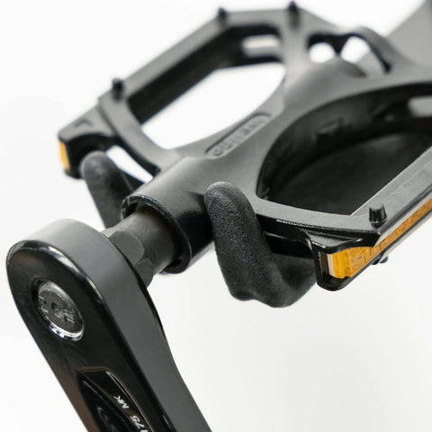 Wall Mounted Bike Pedal Hook Rack For Indoor Storage And Garage Organization With Tire Brackets Space Saving Hanger to Hold Three Bikes At A 45 Degree Angle No Handlebar Turning, close-up of black pedal hook component.