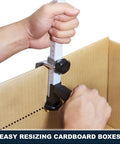 Box Resizer Tool With Safety Blade Cover And Scoring Wheel For Custom Box Size Up To 10 Inches Deep, No Guesswork Reducing Cartons To Exact Dimensions For Ecommerce, Retail And Warehouse Packing. Metal carton resizer on cardboard box.
