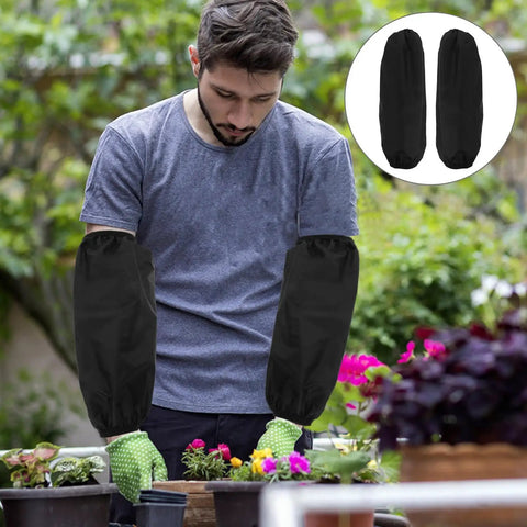 Tough As Nails Four Pack Waterproof Arm Sleeves With Thick Elbow Guards Grease Proof Oil Resistant Protective Oversleeves For Mechanics Shop Floor And Weekend Grind In Black worn by a man while gardening.