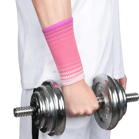 Person using Mens Sports Wrist Support Band For Weightlifting And Fitness Pain Relief, lifting dumbbell, wearing pink sleeve.