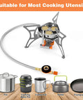 Powerful 6800W Windproof Camping Stove for Backcountry Cooking with various compatible cookware displayed