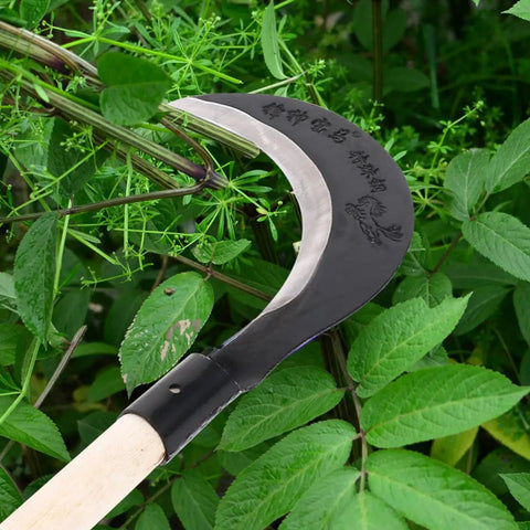 Manganese Steel Long Handle Hand Scythe For Weeding And Lawn Care With Thick Blade Heavy Duty Garden Tool For Outdoor Use shown in greenery