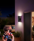 Up And Down Outdoor Wall Sconce With APP Control, RGB CCT Color Changing Exterior Light Fixture illuminating porch at night