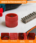 Front view of red plastic pipe deburring tool with ribbed body and inner blades; drill nearby.