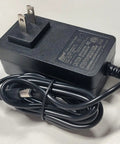 Black power adapter with plug, used to charge Top Shelf Electric Coffee Mug Warmer With Smart Temp Controls.
