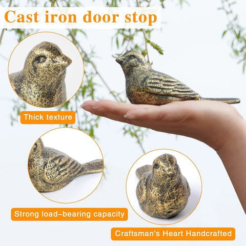 Close-up of heavy-duty cast iron bird door stopper with antique bronze finish, rustic vintage decor.