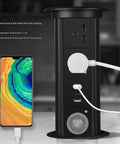 Waterproof Pop Up Power Strip With Smart Lifting Mechanism For Desk And Kitchen, showing three charging ports and a smartphone.