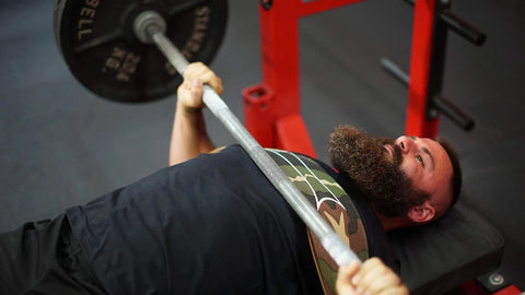 Person using Bench Press Assist Strap With Level 3 Tension Red Powerlifting Gear Lets You Press 10 To 15 Percent More Weight