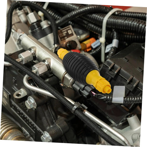 Portable Transfer Pump For Trucks, Cars, And Boats - Manual Siphon Pump For Fast Liquid Transfer, Easy Extraction, No Spill Design, Anti Leak Air Feature, Great For Yachts And Heavy Equipment Tools. Black and yellow hose fitting on engine assembly