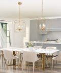 Gold Pendant Light With Cylindrical Lattice Cage Frame And Spherical Center above a modern dining table