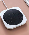 Smart Desk Electric Coffee Mug Warmer With Three Adjustable Heat Settings And Twelve Hour Auto Shut Off on a waterproof surface.