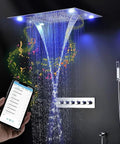 Top Shelf Ceiling Mounted Matte Black Shower System With A Straight Up Solid 23 By 31 Inch Stainless Steel Showerhead, showcasing illuminated rain effect.