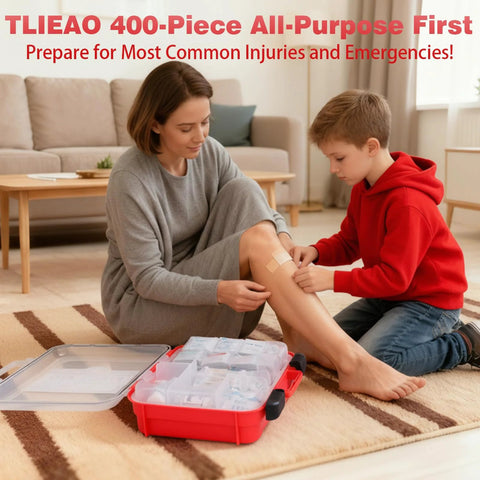 First aid kit, 400-piece, red plastic case, open on floor; woman bandages knee while child helps.