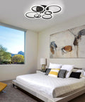 Sleek Modern LED Flush Mount Ceiling Light With Six Black Rings, Low Key Low Profile Ceiling Fixture in a bedroom setting.