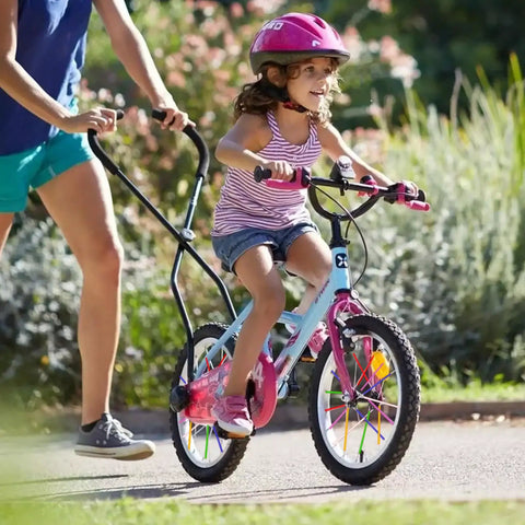 Child riding a bike with colorful spoke covers, assisted by an adult, showcasing 180 Pcs Spoke Skins And Covers In 10 Dope Color Mix.