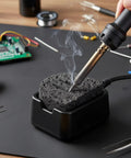 Soldering Iron Cleaning Sponge Set 10 Piece 50x60x10mm in use on electronics workbench, visible with steam.