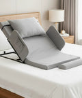 Big Power Electric Recliner Backrest With 300 Lbs Capacity on a bed, gray fabric, ideal for lumbar relief and comfort.