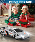 Holiday scene with kids holding gifts and a Beast One Eighteenth Scale RC Car For Kids Gift Ready with lights on.