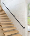 12ft Galvanized Steel Stair Railing Kit With Iron Balusters Easy Install Indoor Outdoor Hand Rail For Home And Commercial Spaces Built Tough For Daily Grinds And Safer Stairs installed on concrete wall beside wooden stairs