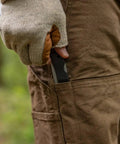 Man withdrawing Six Point One Inch Lightweight EDC Folding Knife With Stainless Steel Blade USA Made from brown pants pocket