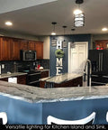 Sleek Modern Mini Pendant Light For Kitchen Island And Dining Room With 6.3 Inch Matte Black Spiral Cage And Handblown Frosted Glass Shade Adjustable Cord 1 Pack hanging over a kitchen island.