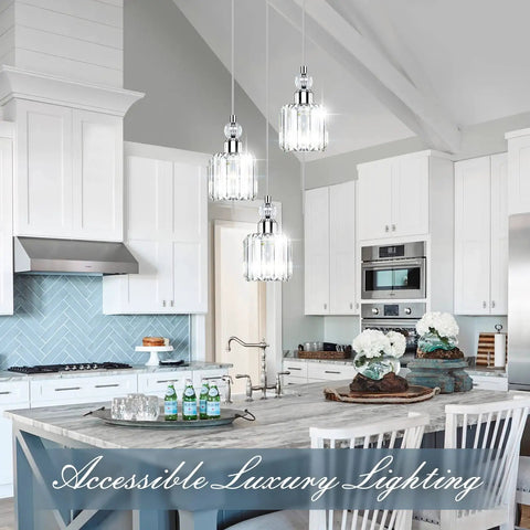 Modern Three Light Crystal Cluster Pendant Chandelier For Kitchen Island Dining Room Table Adjustable Hanging Lights In Chrome With Cords You Can Tweak Up To Fifty Three Inches For Perfect Height in a kitchen setting with white cabinetry.