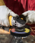 Person using angle grinder with 10 Pack 4.5 Inch Strip Discs For Angle Grinder Heavy Duty Paint Removal And Rust Scraping