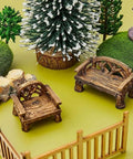 Set Of 2 Miniature Resin Garden Benches For Fairy Village Dollhouse Decor, Totally Cute Fairy Garden Furniture next to model trees