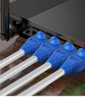 Soft PVC RJ45 Strain Relief Boots For Cat5 Cat5e Cat6 Cables Blue 100 Pack shown in network switch setup