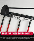 Robust Heavy Duty Mounting Tape Industrial Strength Double Sided Hook And Loop Roll Black 10 Foot X 2 Inch used to secure tools on a wall.