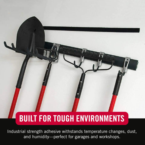Robust Heavy Duty Mounting Tape Industrial Strength Double Sided Hook And Loop Roll Black 10 Foot X 2 Inch used to secure tools on a wall.