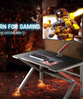 Single Gaming Monitor Arm With Mechanical Spring Load, fully adjustable for up to 32 inch screen mounted on gaming desk.