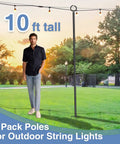 Man standing next to 10ft Adjustable Outdoor String Light Poles for Yard And Patio With Quick Assembly in a garden.