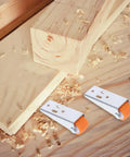 Heavy Duty 2 Pack Sliding Door Rollers For Wood Barn Tracks And Closet Cabinets With Nylon Wheels And Reinforced Steel Brackets on wood surface.