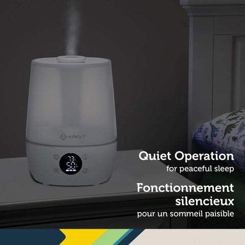 Filter Free Humidifier With Auto Humidity Control And Hygrometer on bedside table, LCD shows humidity levels, white finish.