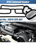 Honda VTEC Solenoid Valve Gasket For Acura Honda Models Oil Leak Prevention With Premium Rubber Core Triple Seal Technology And Self Venting Design For Engine Variable Valve Timing And 100000 Miles shown uninstalled next to engine.