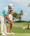 Father and child using Go-To Golf Swing Trainer And Practice Aid, Heavy Duty Metal Stand, Portable And Easy To Set Up, on golf course
