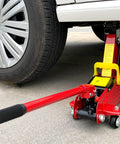 2 Ton Floor Jack Replacement Handle for Car Jack installed on red horizontal hydraulic jack lifting car