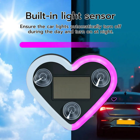 Heart Shaped Car LED Ambient Light With Solar Rechargeable Power showing pink glow and built-in light sensor with car background