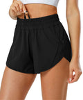 Close-up of Women's Quick Dry Go-To Track And Running Athletic Shorts For Training With Elastic Waistband Zip Pockets Built In Liner Featherweight Stretch Breathable Recycled Polyester No Slip Fit Black Small.