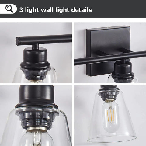 Three Light Black Vanity Lights Over Mirror, detail of metal base, matte black finish, clear glass shades, wall sconce lighting.