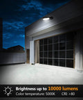 Two Pack 100W LED Barn Light With Dusk To Dawn Sensor illuminating a driveway at night, showing 5000K daylight color temperature.