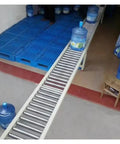 Light Duty Galvanized Steel Conveyor Roller Slides No Power Needed Portable Rustproof Workhorse For Warehouses And Factories Easy Splice Design For Quick Bucket Unloading And Smooth Material Handling on water bottles