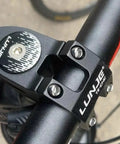 Close-up of black LUNJE bike stem attached to handlebars, compatible with Beefy Aluminum Bike Stem 25.4mm Or 31.8mm Handlebar Fit.