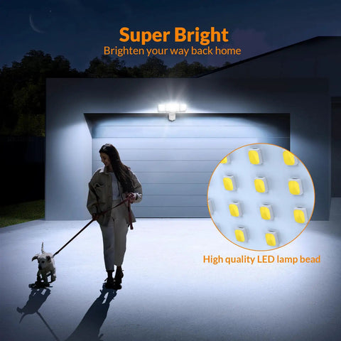 Solar Powered Motion Sensor Outdoor Light With 1600 Lumen White Flood Beams illuminating a walkway at night