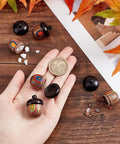 Five Pack Rainbow Wood Acorn Pendant Set With Openable Mini Cremation Urns for Ashes, shown with hand for size comparison, 30x22mm.