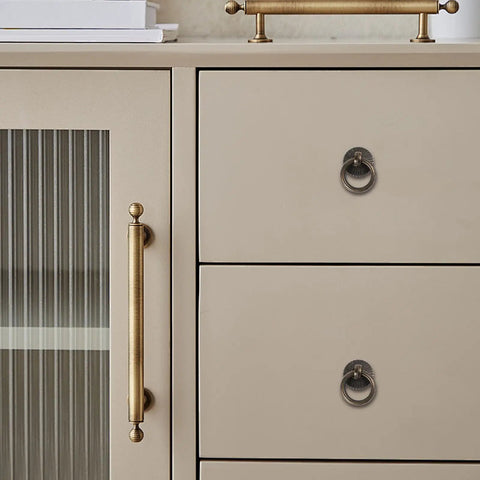 Close-up of cabinet with Vintage Style Ring Pull Cabinet Handles 4 Pack Antique Bronze Drawer Pulls For Dresser Kitchen Cupboard.